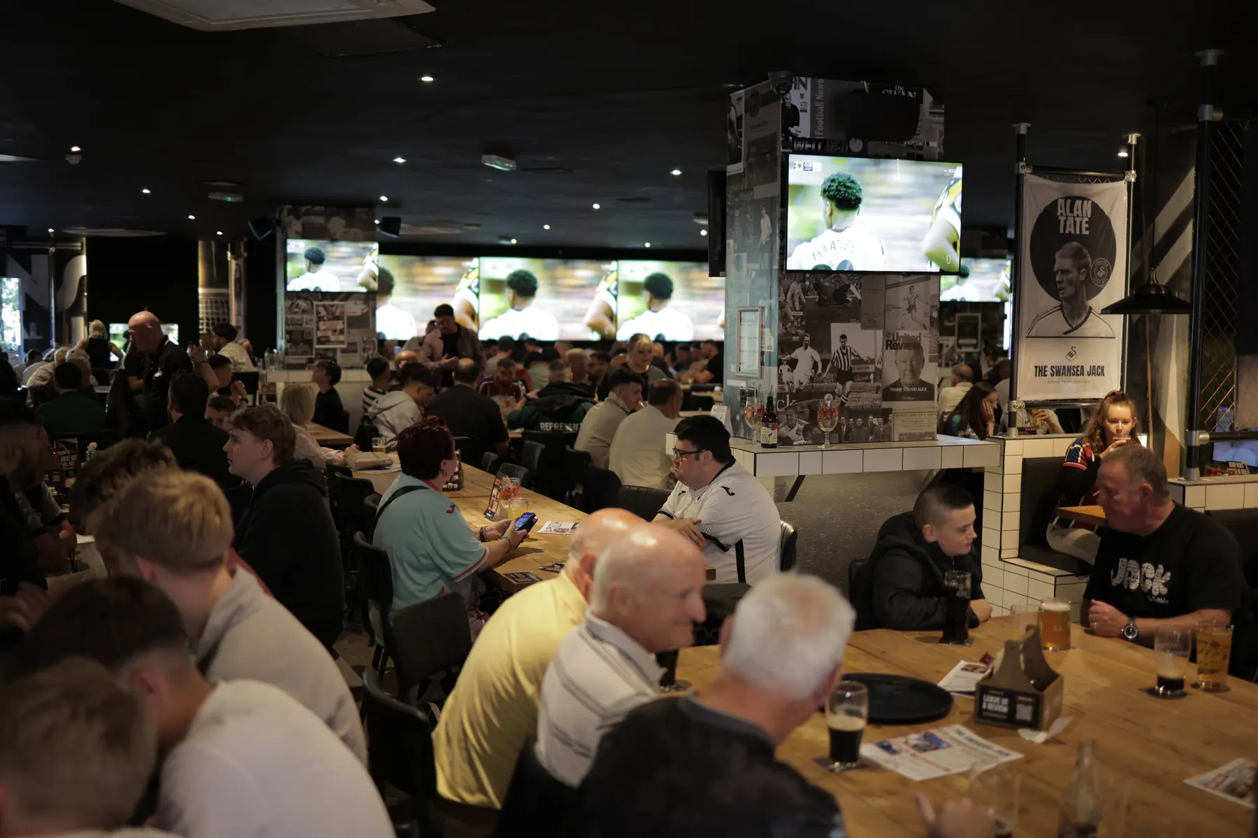 The Swansea Jack on a matchday: a full bar watching the game on the big screens