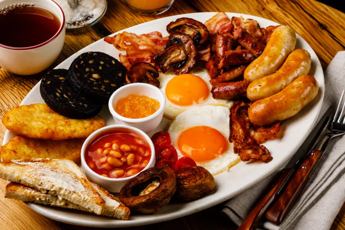 A full English breakfast with eggs, sausages, bacon, black pudding, beans and toast