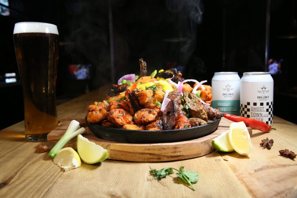 A sizzling mixed grill with a pint of lager