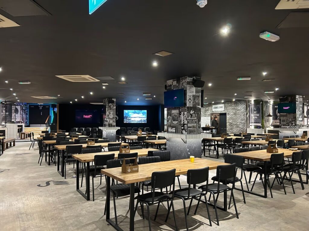 Long tables and big screens in the main bar