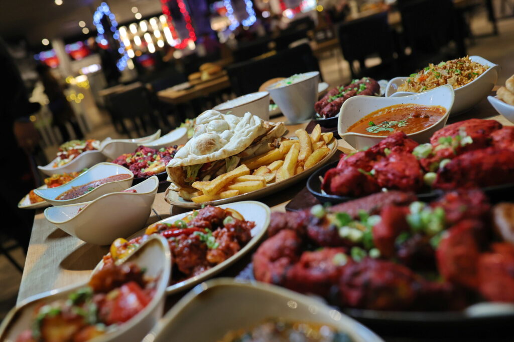 An Indian buffet laid out across the tables